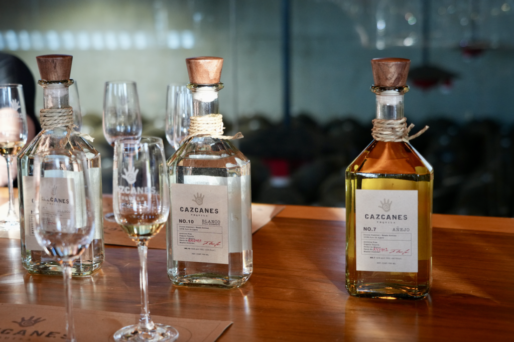 Premium additive-free sipping tequilas including Cazcanes displayed for tasting at Aroma Thyme Bistro